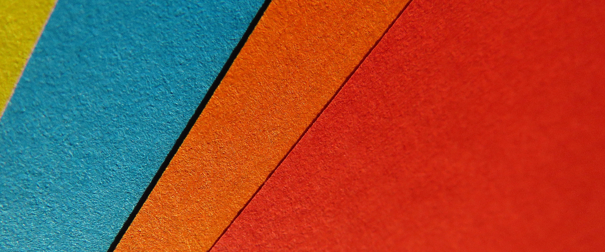 Colorful sheets of paper fanned out flat
