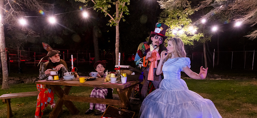 scene from Alice in Wonderland staged outside on the grounds of Glensheen mansion