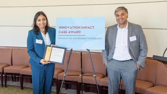Photo of Dr. Devaleena Das receiving her award