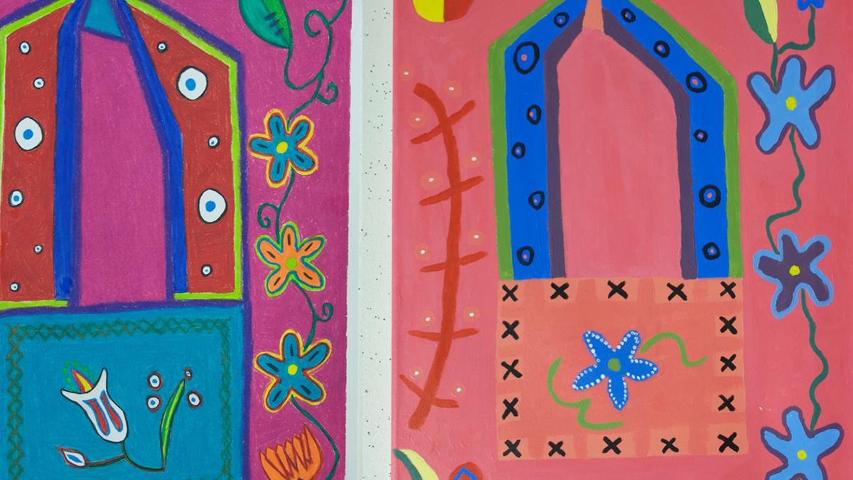 Closeup of brightly colored floral paintings