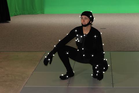 Student dressed in motion capture suit in the MMAD Lab
