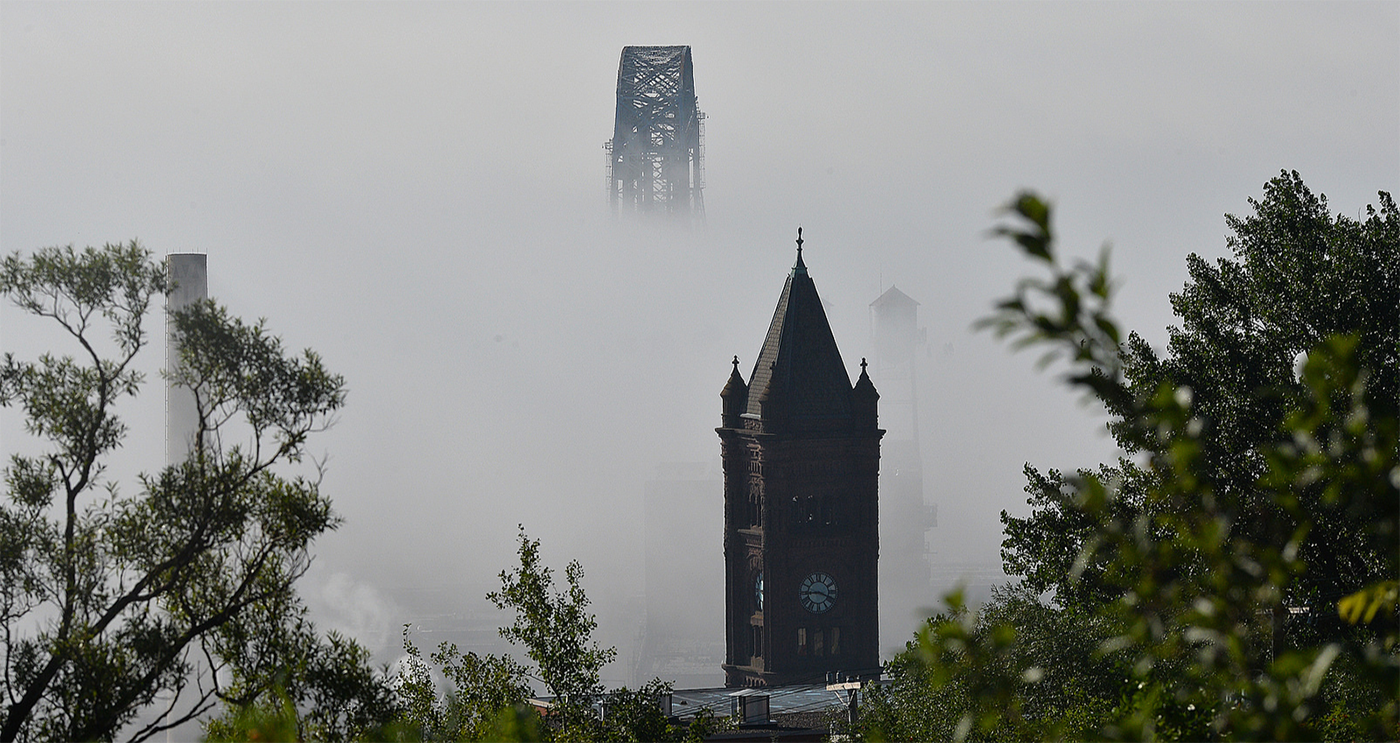Central Clock Tower with Aerial lift bridge in a foggy background