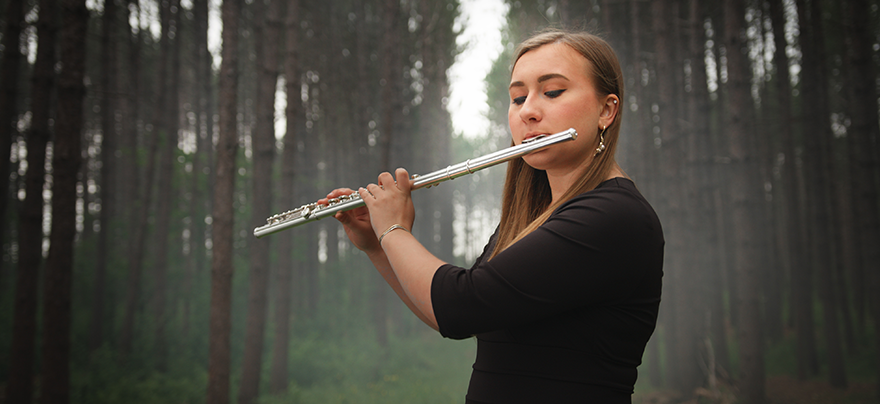playing flute in the forest